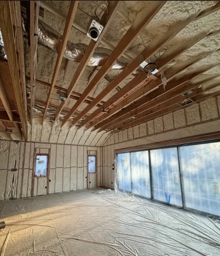 Interior walls and ceiling insulated with spray foam during new construction in Walled Lake